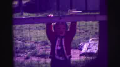 Lynbrook New York (1976): Shot Of A Young Boy In A Red Sweater Standing And