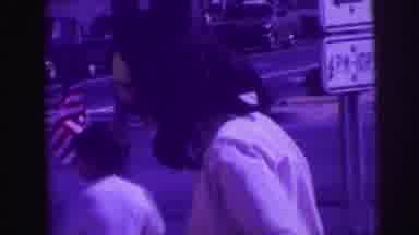 Lynbrook New York (1976): Woman Buildings Street Daylight Celebration Cheering