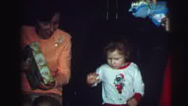 Lynbrook New York (1976): Woman Opens Gifts For Children On Festive Christmas Day