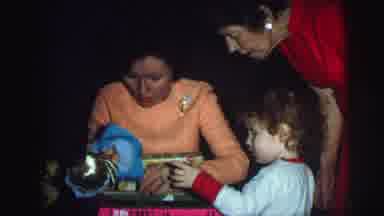 Lynbrook New York (1976): A Family Is Looking At A Doll Appears To Be A Present