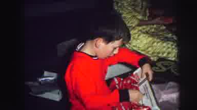 Lynbrook New York-1976: Boy Opening Gifts with Family