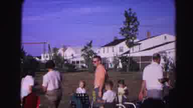 Hagerstown Maryland Usaa (1963): Man In A Pink Shirt Moving A Fold Up Chair