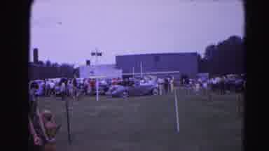 Hagerstown Maryland Usaa (1963): Two Vintage Cars Drive Over Grass At An Event