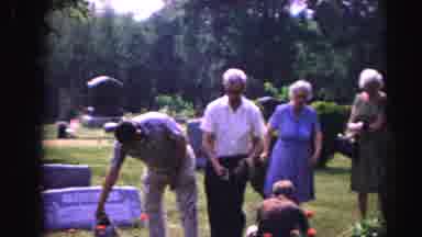 Hagerstown Maryland Usaa (1963): Man Wearing Tan Shirt Waters Tombstone Flowers On