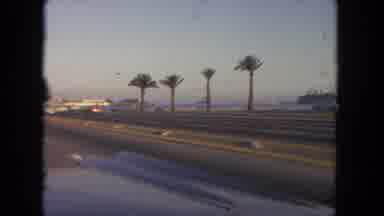 Tijuana Mexico (1962): Vintage Car Riding A Street In A City By The Sea With Palm