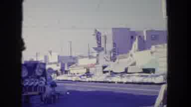 Tijuana Mexico (1962): Man And Woman Walk Across Street On A Bright Sunny Day