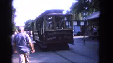 Tijuana Mexico (1962): Trolley Car Speeds By People While Approaching Stop On A