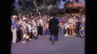 Tijuana Mexico (1962): People Following A Man That Is Pushing A Wheelbarrow