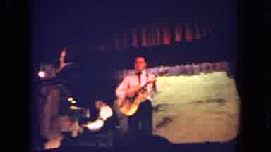 San Diego California (1962): The Man Playing A Guitar Fastly In The Stage