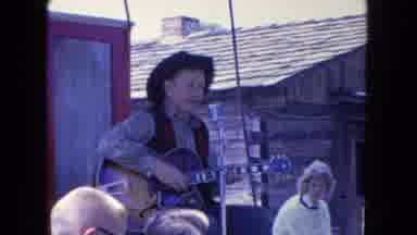 San Diego California (1962): A Man Playing Guitar And Singing The Song In The