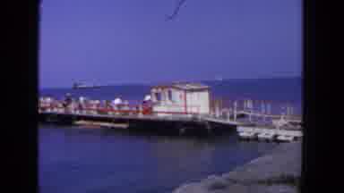 San Diego California (1962): Panning Video Of Small Pier With Hutan People On It
