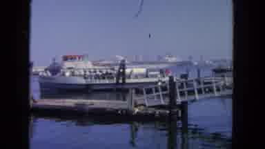 San Diego California (1962): Multiple People Leave A Ferry And Walk Up A Dock
