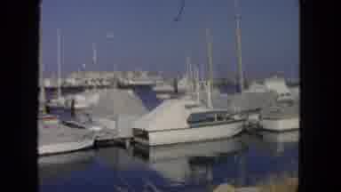 San Diego California (1962): Boats Parked At A Dock With One Boat Leaving The Dock