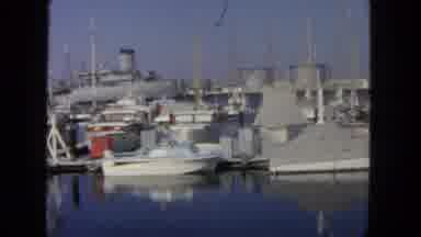 San Diego California (1962): A Scene Of People Walking Near Some Boats On Water