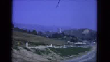 San Diego California (1962): A Vehicle Travels Down A Highway In A Mountainous