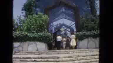 San Diego California (1962): A Group Enters Into A Glass Atrium Leading To A