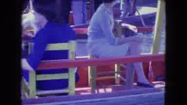 Mexico City (1962): People Sitting On Chairs While Riding On Gondola Is Pushed