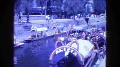 Mexico City (1962): An Old-Fashioned Boat Travels Leisurely Through A Canal