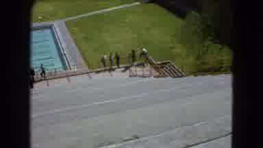 Mexico City (1962): People Standing By A Railing Overlooking A Large Swimming Pool