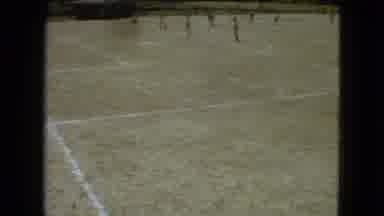 Mexico City (1962): People Playing Soccer On A Dirt Field As The Goalie Kicks The