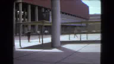 Mexico City (1962): There Are People Walking Outside A Building And Into A Large
