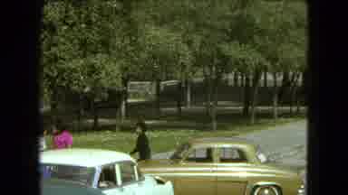 MEXICO CITY-1962: People Park Their Cars And Walk Towards A Building That Looks