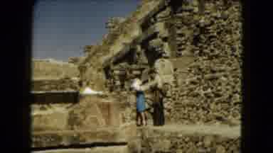 Mexico City (1962): A Couple Walking Carefully Through A Historical Landscape