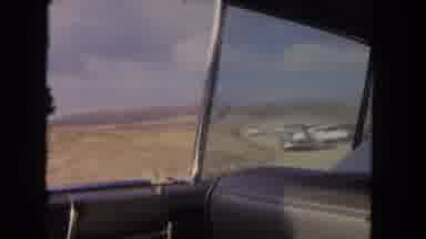 Los Angeles California USA (1962): The Car Is Going On The Road Near Fully Covered