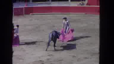 Los Angeles California USA (1962): Two Matadors Interact With A Bull In A Round