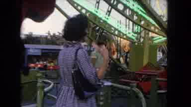 Los Angeles California USA (1962): Old Time Carnival With Caged Rides Mom Watching