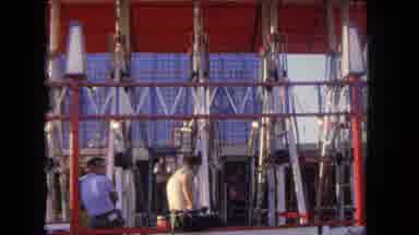 Los Angeles California USA (1962): People Watching Two Others Standing In A Cage