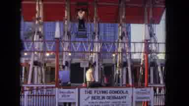 Los Angeles California USA (1962): People Riding In Flying Gondola Ride At