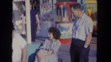 Los Angeles California USA (1962): 3 People Sitting And Talking In The Middle Of