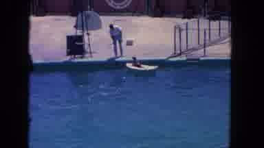 Los Angeles California USA (1962): Dog Starts Floating Down The River As A Man Is