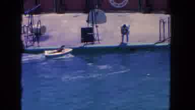 Los Angeles California USA (1962): A Trainer Gets A Dog To Drive A Small Boat In A