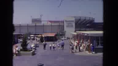 Los Angeles California USA (1962): People In A Parking Lot Walking Into A Stadium