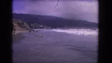 Los Angeles California USA (1962): People At The Beach Playing In The Crashing