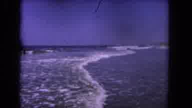 Los Angeles California USA (1962): People Enjoy The Beach As A Jet Ski Passes By