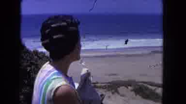 Los Angeles California USA (1962): A Lady Talking Someone And See The Tidal Wave