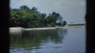 Illinois USA (1962): A Lake Surrounded By Trees Water Appears To Be Moving Quickly