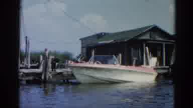 Illinois USA (1962): A Boat On The Dock Then In The Open Water