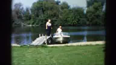 Illinois USA (1962): Two Men Boarding A Boat Lakeside