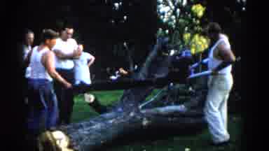 Illinois USA (1962): Two Men With Very Large Chainsaw Getting Ready To Cut Tree