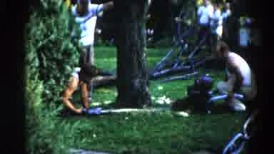 Illinois USA (1962): Man Turning On Water While One Watches By Tree And Man