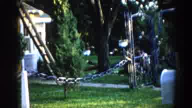 Illinois USA (1962): Children Playing In The Background While 3 Hard Working Men