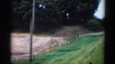 Illinois USA (1962): Car Driving Along Straight Flat Country Road In A Rural