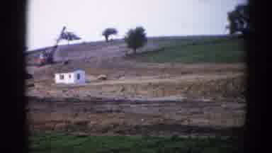 Illinois USA-1962: Rural Hills And Fields With Construction Activity And Vintage Film Grain