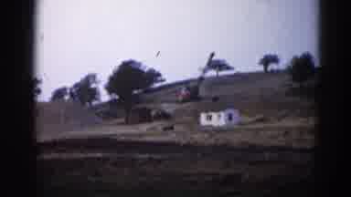 Illinois USA (1962): A Small White House On A Hillside Huge Dirt Pile And Crane To