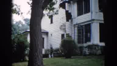 Illinois USA (1962): Two Story White Sided House Showcasing Two Large Screened In