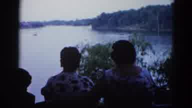Illinois USA (1962): Group Of People Accompany Water Skiing On The Edge Of A